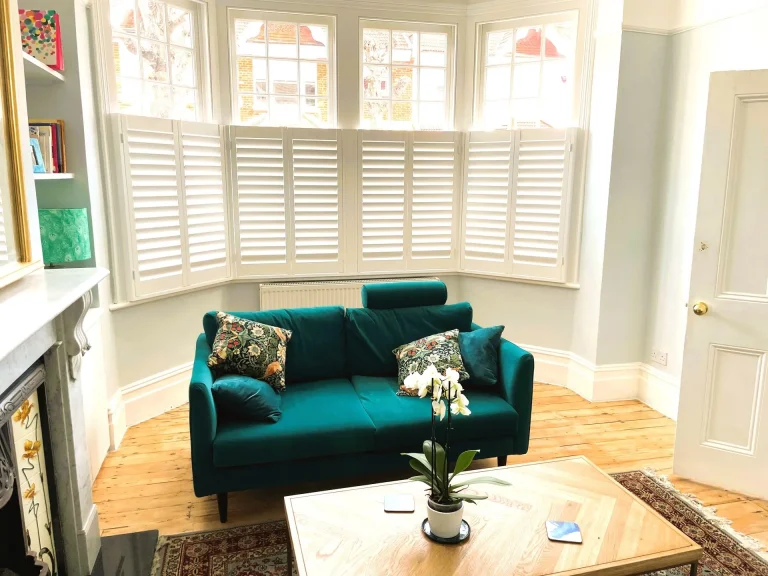White café shutters in a bright living room